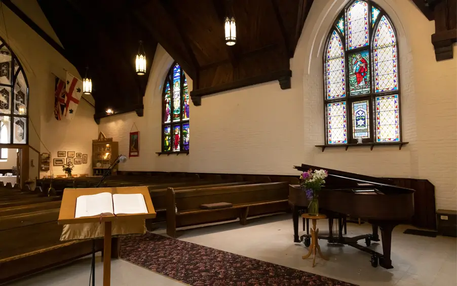 View of the pews and piano inside the church
